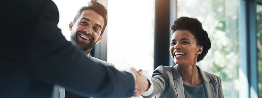Happy business people, handshake and meeting in teamwork for partnership or collaboration in boardroom. Woman person shaking